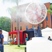 Grace Dong, enviromental occupational health major, tries to keep cool by the mist fan at the A.S. Fair on the second day of classes on Tuesday. Photo Credit: Andres Aguila / Daily Sundial