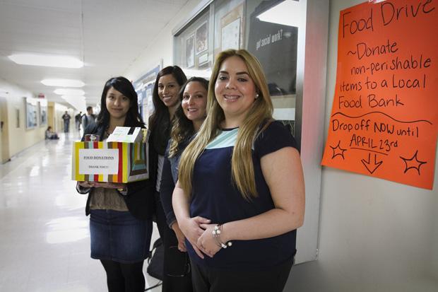 Masters of social work students, Adriana Rubio, Patricia Franco, Elizabeth White, and Michaela Chapman by the social work office in Sierra Hall. They have set up food collection boxes for the Valley Food Bank and the Hope of the Valley Rescue Mission for a social work project on hunger issues in Northridge. They have five food collection boxes on campus. Photo credit by Charlie Kaijo / Senior Photographer