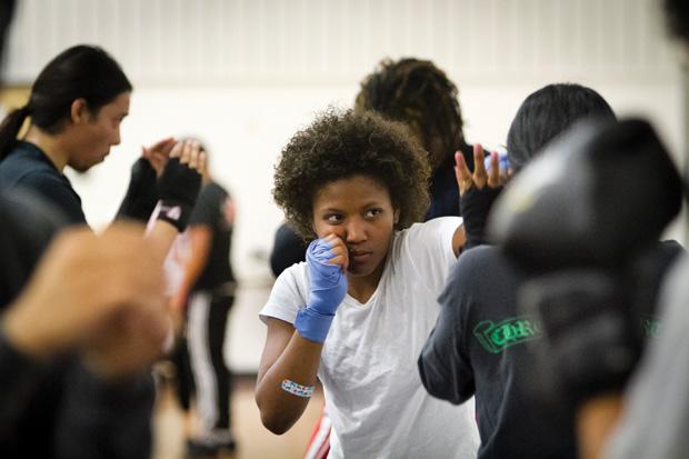 Tiffany Randle, media management major, practices jabs with a partner at the CSUN Boxing Club meeting. Photo credit by Charlie Kaijo / Senior Photographer
