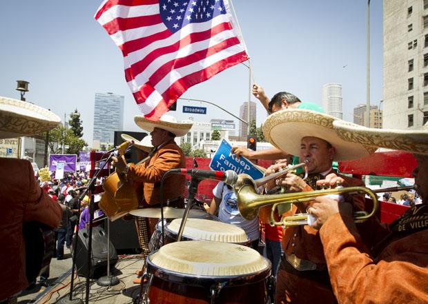 A Mariachi band performs for May Day participants at a rally on Olympic Boulevard and Broadway Street. Photo credit by Charlie Kaijo / Senior Photographer;
