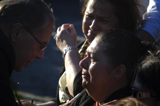 Family members mourn the loss of 26-year old Marcela Franco and her father Carlos Franco at a memorial for the victims of the Santa Monica shooting. Photo credit: Charlie Kaijo / Senior Photographer