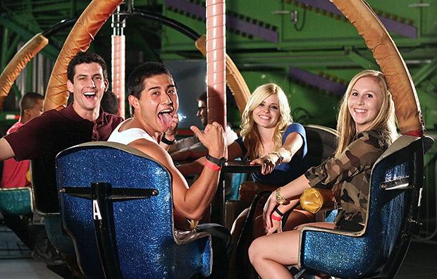 Recreation and tourism management major Travis Hoogervorst, 24, exercise science major Mike Ho, 22, communication studies major Jessica Pimentel, 18, and biology major Jessica Gordon, 17, about to go on the spinning "Tornado" ride. Photo credit: Lucas Esposito / Daily Sundial