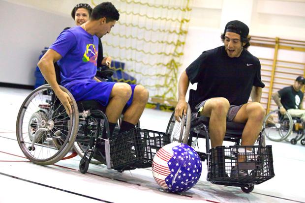 Kinesiology students Andreas Duran, 22, and Jesse Martinez, 21, from the Adapted Thereaputic Exercise class learned to play Power Soccer at a clinic held in Redwood Hall by four local athletes on Monday. Photo credit: Loren Townsley / Daily Sundial
