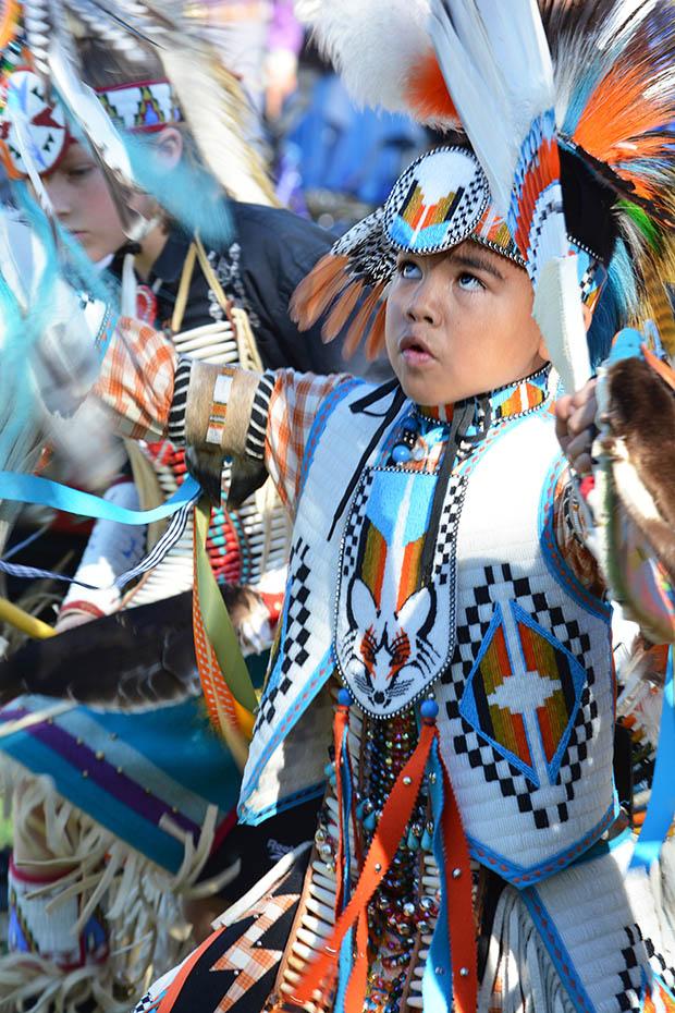 More than 40 dancers entered the arena in their American Indian regalia on Saturday. Photo credit: John Saringo-Rodriguez / Photo Editor