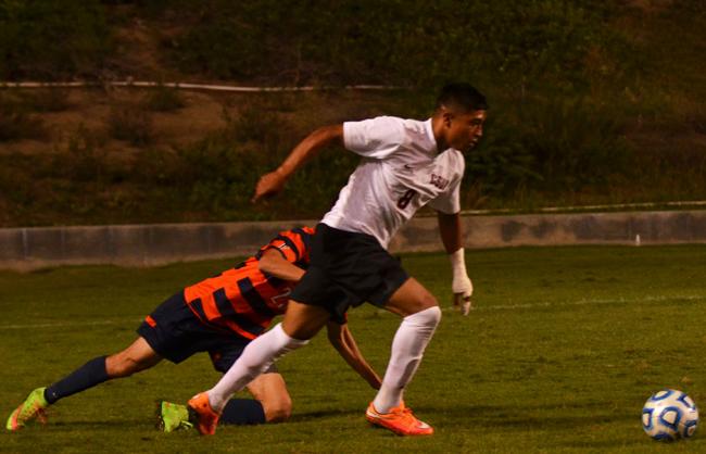 Senior forward, Edwin Rivas, leaves a Cal State Fullerton defender on the floor before crossing the ball into the box for a header. The chance was cleared as the Matadors lost to the Titans 1-0. Photo Credit: Vince Nguyen/Photo Editor
