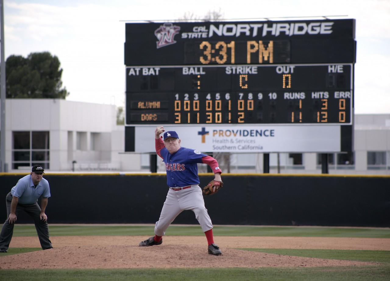James "Jim" Mosely, age 72,  takes the mound and throws a strong 8th-innning in the alumni game at the Matador Field in Northridge, Calif., on Sunday January 25, 2015. Photo credit: Raul Martinez