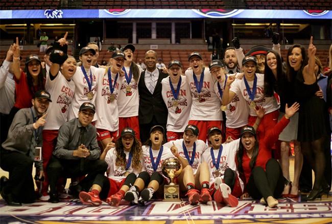 The CSUN Matadors celebrate thier back-to-back title in the Big West Conference after deefeating Hawaii by a final score of 67-60 at the Honda Center on March 14. (Raul Martinez/ Staff Photographer)