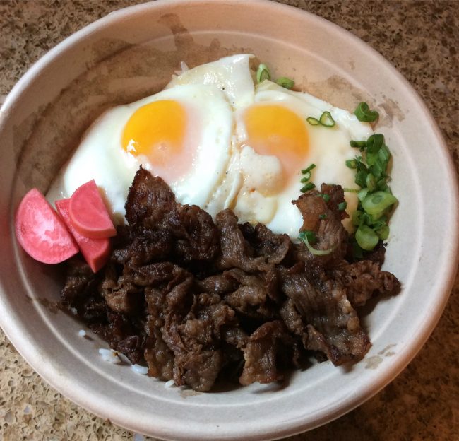 Oi's Adobo Bowl, $8, consists of braised pork belly, adobo sauce, soft boiled egg and scallions. (Genna Gold/The Sundial)