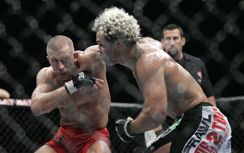 Georges St. Pierre, left, punches Josh Koscheck during a UFC 74 mixed martial arts match at the Mandalay Bay Events Center in Las Vegas, Nevada, Saturday, August, 25, 2007. Photo Caption: Francis Specker /MCT