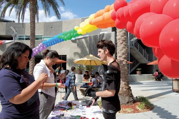 Over a hundred students attended the National Coming Out Day hosted by the Lesbian Gay Bisexual Transgender Alliance (LGBTA) on Wednesday at the Plaza Del Sol courtyard. Students were able to make rainbow necklaces and pin rainbow ribbons on their clothes to show support on the day's celebration. Photo Credit: Jacky Guerrero / Online Editor