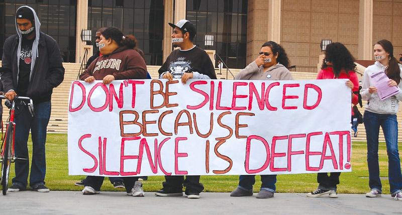 CSUN students participate in the budget cut protest Monday by putting tape over their mouths that read, "My Voice," "Your Voice," "Our Voice", and "Students Voice."