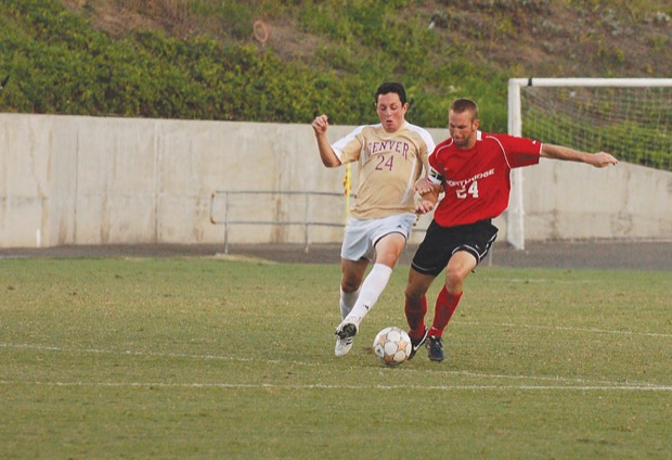 Defender Chad Borak battles with Nick Brant of Denver in a game earlier this season at Titan Stadium. Sundial File Photo.