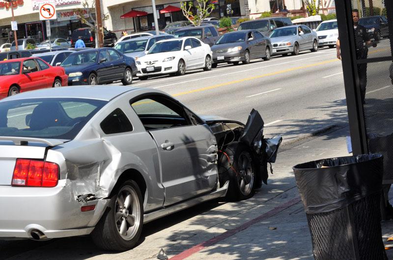 A collision with a garbage truck occurred on Nordoff St. and Reseda Blvd. damaging the right side of a mustang. Photo Credit: Wendy Peters / Staff Reporter