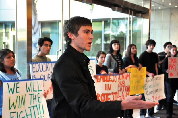 Cal State Fullerton sophomore Bryan Norton, 19, asks CSU personnel and officers, “May we be present in our own meeting?” After negotiating, the students were given the right to be present during the meeting. Photo Credit: Patrick Dilanchian/ Contributing Photographer