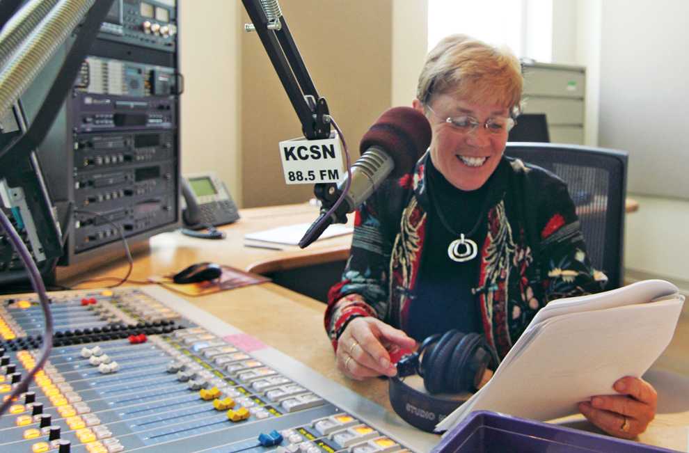 Karen Kearns, general manager of KCSN, reads a script and demonstrates what she would normally do to record spots, which include ticket giveaways and support for programs. Photo Credit: Simon Gambaryan / Contributor