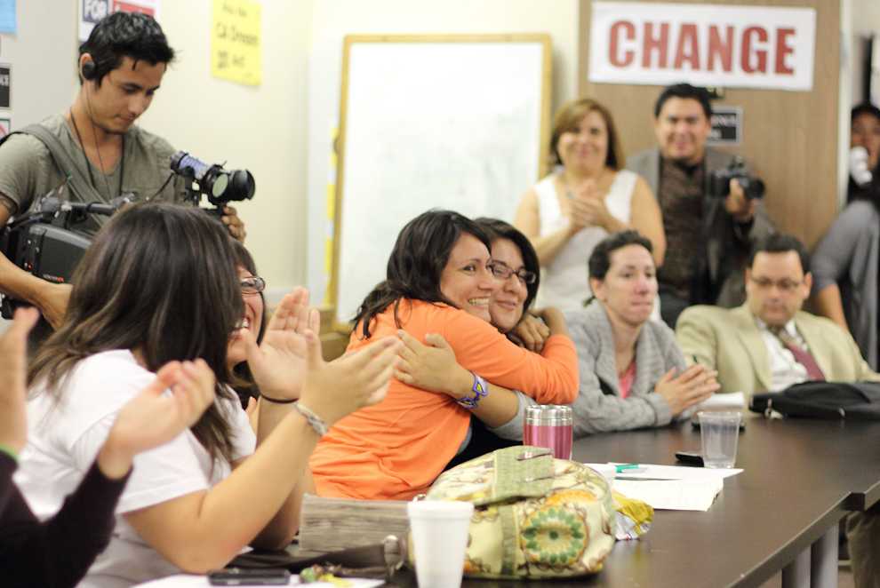 It passed: Helena Villa and Mirna Ortiz hug to celebrate the passing of AB 131 at the Coalition for Humane Immigrant Rights of Los Angeles on Friday. Photo Credit: Simon Gambaryan / Daily Sundial