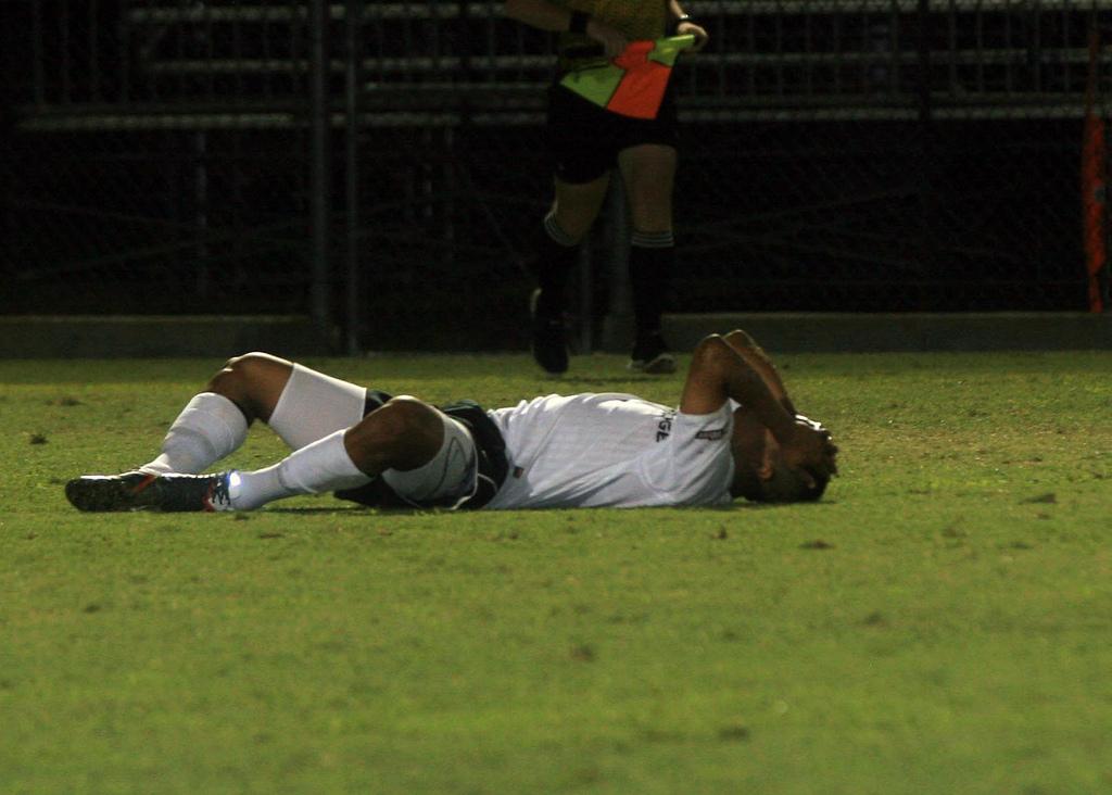 Disappointment: One of the Matadors falls to the ground and covers his face following CSUNs 2-1 overtime loss to UNLV at the Cal State Northridge Labor Day Classic on Thursday night. Photo Credit: Daniel Hoyos / Contributing Photographer  