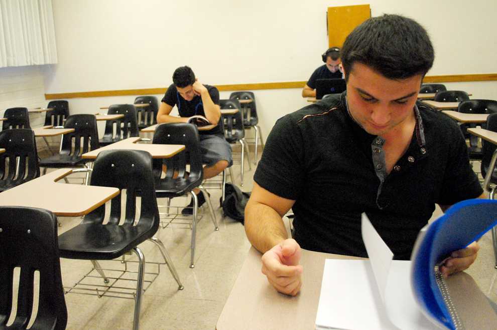 Ari Emuriamn, 23, economics major, reviews his book as he waits for his 9:30 a.m. Latin America georgraphy class to start. 
