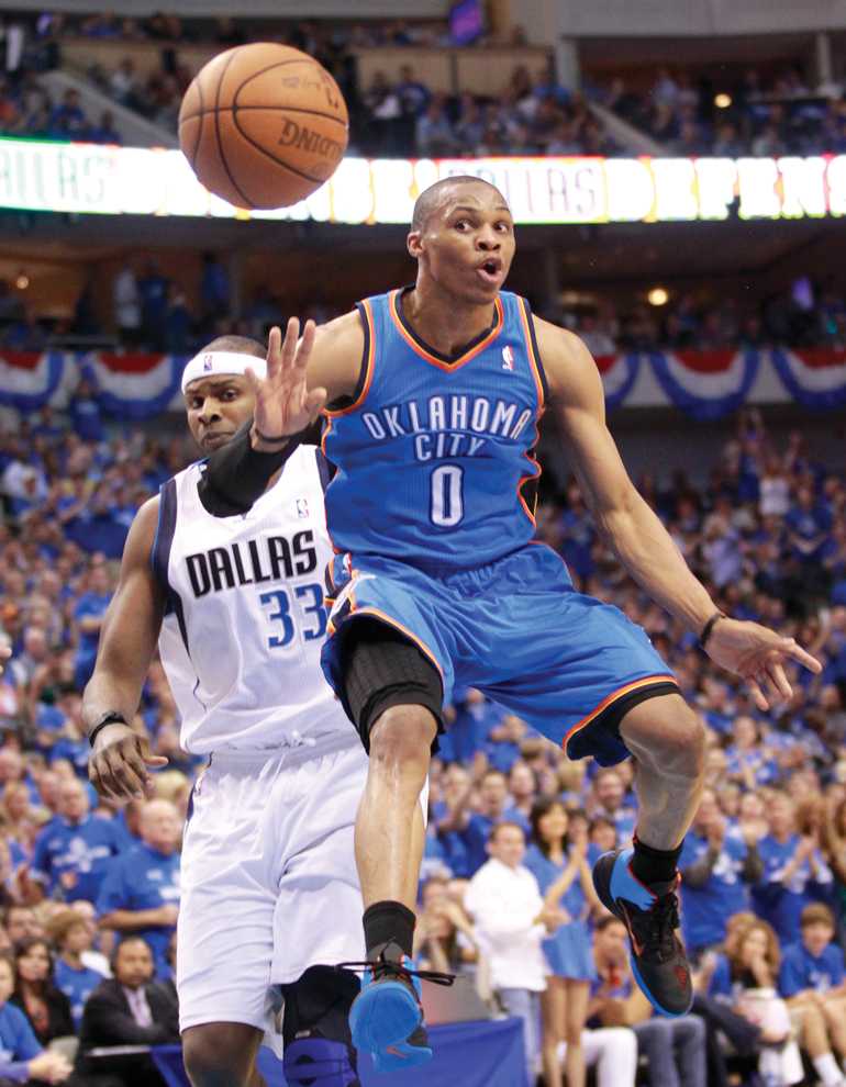 Thunder guard Russell Westbrook makes a pass during a 2011 playoff game against the Mavericks. Westbrook needs to do more of this. Courtesy of MCT