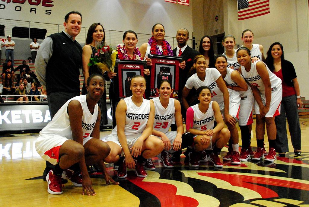 The+Matadors+celebrate+their+two+graduating+seniors%2C+Bridgette+Conejo+and+Jasmine+Erving%2C+after+their+victory+against+CSUF+Saturday+night+at+the+Matadome.+CSUN+is+now+locked+into+second+place+for+the+Big+West+Tournament.+Photo+Credit%3A+Andres+Aguila+%2F+Senior+Photographer