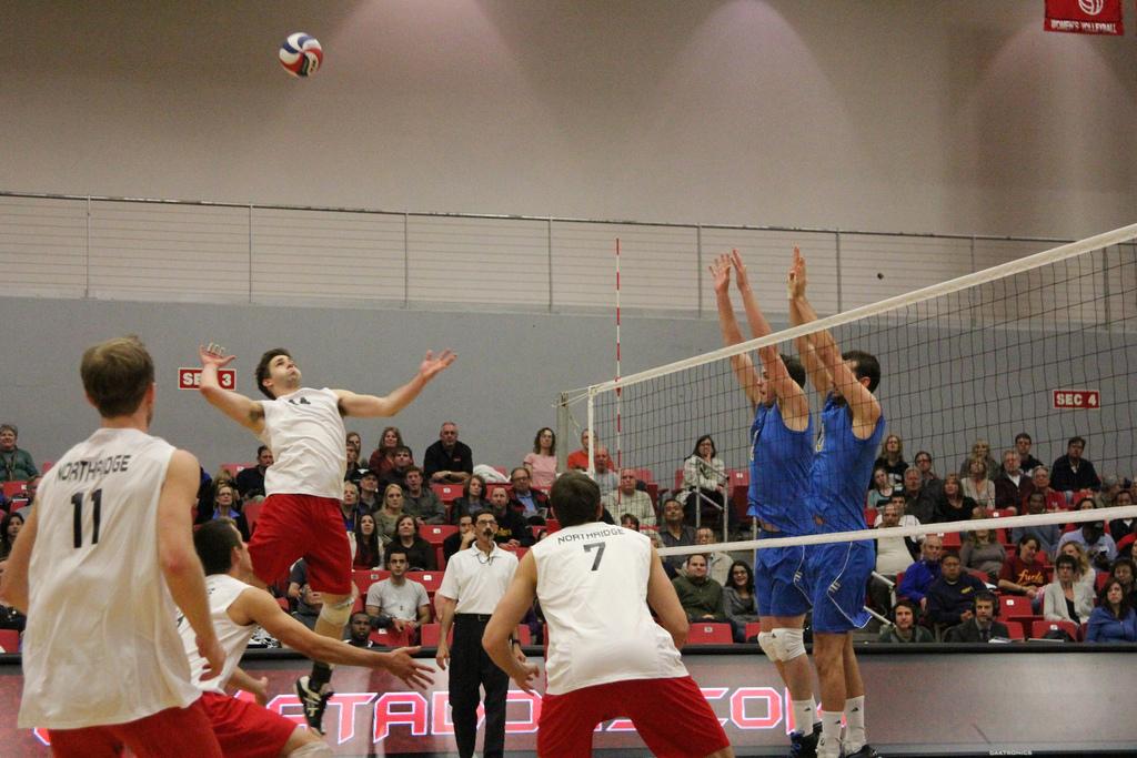 Matador opposite John Baker (14) goes for a kill in their game against UCLA Friday night. Baker, who has been filling in for injured teammate Julius Hoefer, and the Matadors could not contain the No. 1 Bruins. Photo Credit: Michael Cheng / Daily Sundial