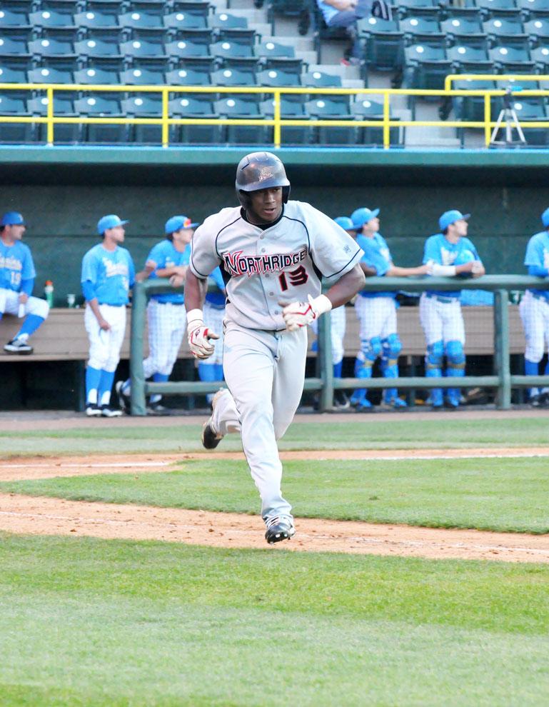 CSUN outfielder Miles Williams tries to reach base at Jackie Robinson Stadium Tuesday. The Matadors hung with No. 11 UCLA early on, but faltered in the seventh inning. Photo Credit: Mariela Molina / Photo Editor