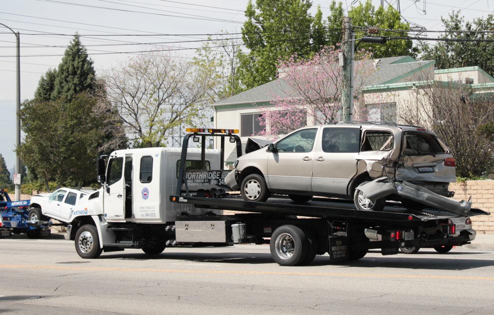 A van is being taken away after being heavily damaged in a three car accident. The accident occured between Lassen Street and Reseda Boulevard yesterday before noon. Photo credit: Jeffrey Zide/ Daily Sundial