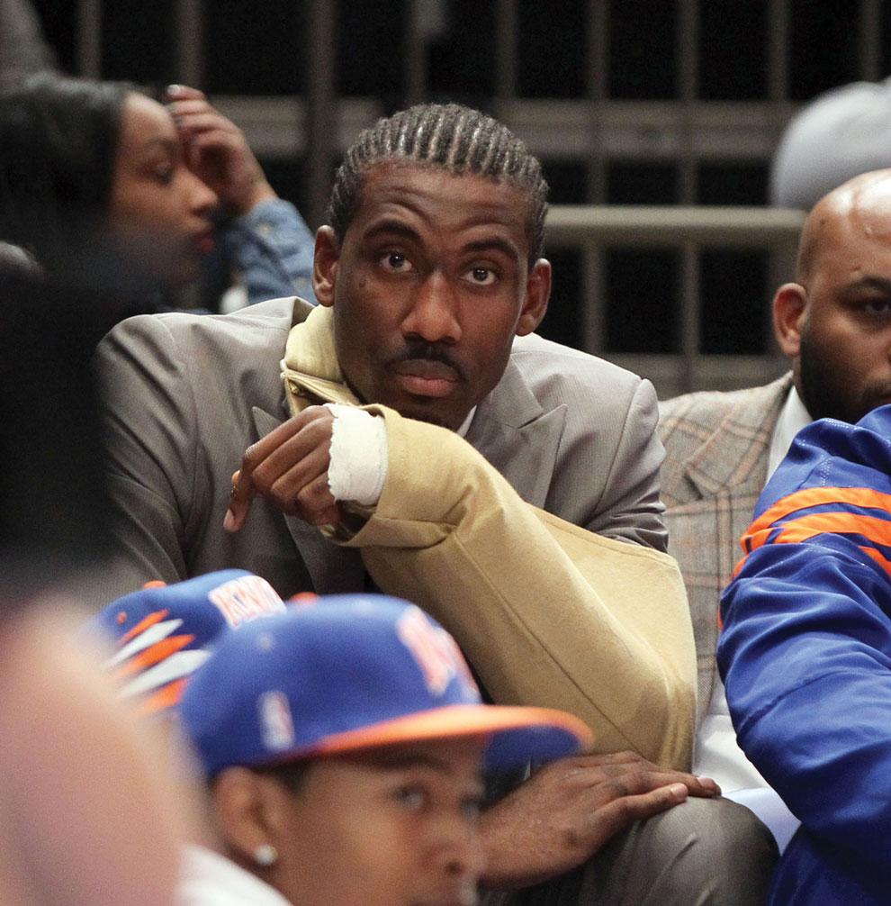 An injured Amare Stoudemire of the New York Knicks looks from the bench during Game 3 against Miami Thursday. Stoudemire injured himself punching a fire extinguisher after Game 2 and later said he did it because he wanted to make some noise. Courtesy of MCT.