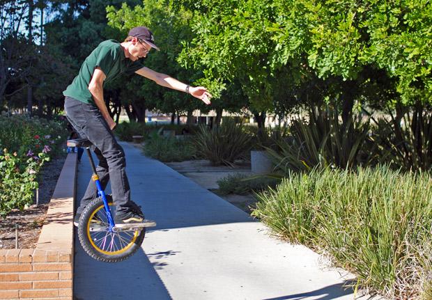 Dennis DAlfonso, mechanical engineering major, rides his unicycle over a ledge near Sierra Hall. I started when I was 8, he said. Once you learn how to ride you dont forget. Theyre tricks that you have. Photo credit: Charlie Kaijo / Assistant Photo Editor