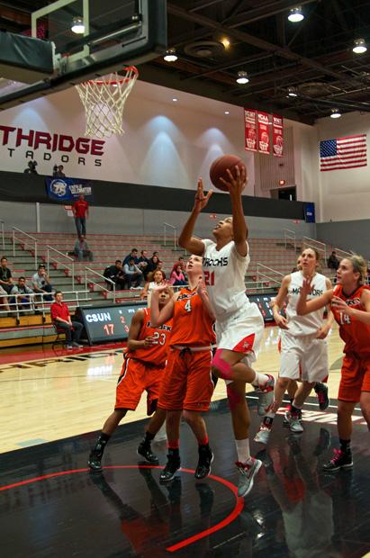 Senior forward Jianni Jackson (21) goes up uncontested for two against Pacific on Valentines Day. Photo credit: Ken Scarboro / Senior Photographer