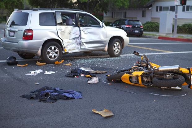 A Kawasaki motorcycle collided with a Toyota Highlander at the intersection of Lindley Avenue and Lassen Street near the CSUN campus Tuesday. The motorcylist was in critical condition as of 7 p.m. Tuesday. Photo credit: Loren Townsley / Photo Editor