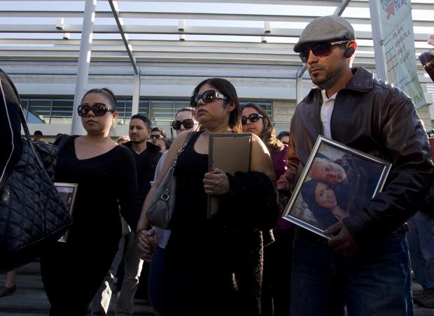 Family members mourn the loss of 26-year old Marcela Franco and her father Carlos Franco at a memorial for the victims of the Santa Monica shooting. They were gunned down in their car by John Zawahri last Friday. Marcella died at the hospital of her injuries.