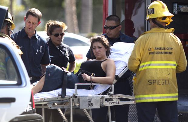 A female suspect was loaded onto an ambulance after police pursuit ended near CSUN on August 29, 2013. Photo credit: Trevor Stamp / Daily Sundial
