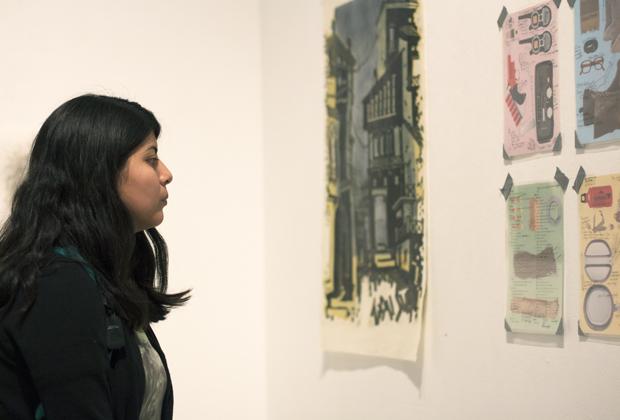 Janet Solval, 22, senior art major, viewed the different types of art during the CSUN Painting Guild's "Meet the Guild" gallery show at the West Gallery room on Wednesday. Solval said she was interested to see the contrast between the abstract and literal paintings at the show. Photo credit: Trevor Stamp / Daily Sundial