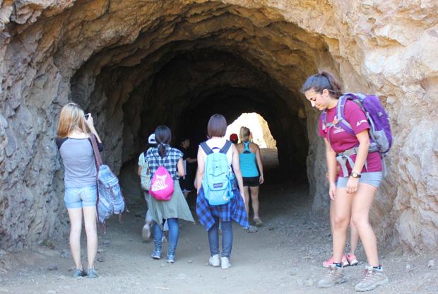 Students walked through the Bronson Cave which served as a filming location for productions such as the entrance to the Batcave in the 1960s Batman TV series. Photo credit: Ana Rodriguez / Daily Sundial