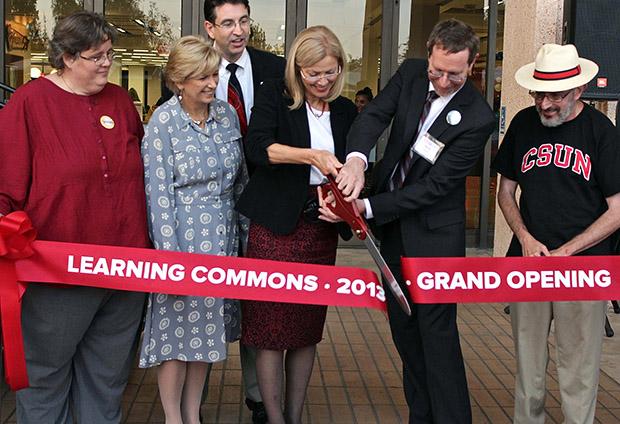 President Dianne F. Harrison and those involved in the planning of the Learning Commons cut the ceremonial ribbon, Thursday, at the Oviatt Library. Photo credit: Lucas Esposito / Daily Sundial