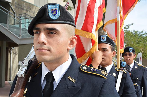 CSUN ROTC member, Edgar Rivas, a political science major, leads his colleagues to the main stage at the USU on Thursday. The Veterans Day event held a national roll call to honor fallen men and women service women in California. Photo credit: John Saringo-Rodriguez / Photo Editor