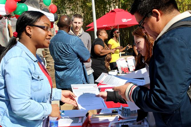 Dr. Raquel Kennon, assistant CSUN professor, welcomes students at the Pan African Booth at the Black History Month Fair on Wedneday. Photo credit: Devan Patel / Daily Sundial