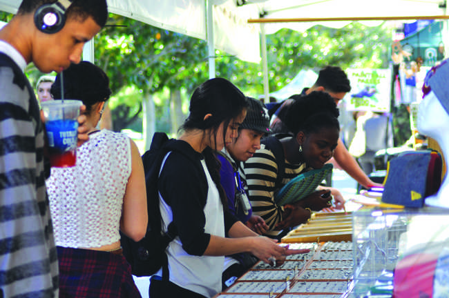 Students look at jewelry available at one of the many booths at Matador Mall in front of Bayramian Hall. Assistant Photo Editor / Ana Rodriguez