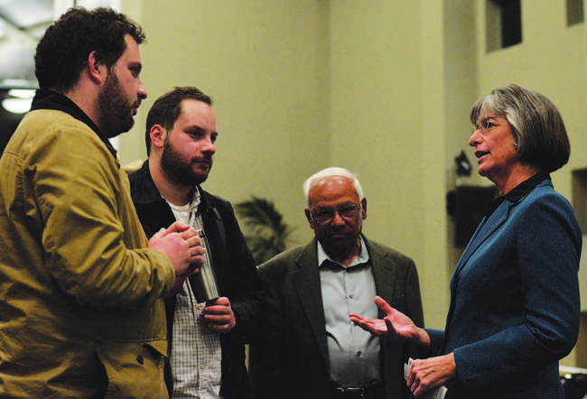 Former Governor Linda Lingle (right) speaks with Adam Morgenstern (far left), 23, senior history major, Michael Morgenstern, 23, and Ram M. Roy, political science professor, after a guest speaker event in the Grand Salon of the USU on Tuesday, Feb. 4.