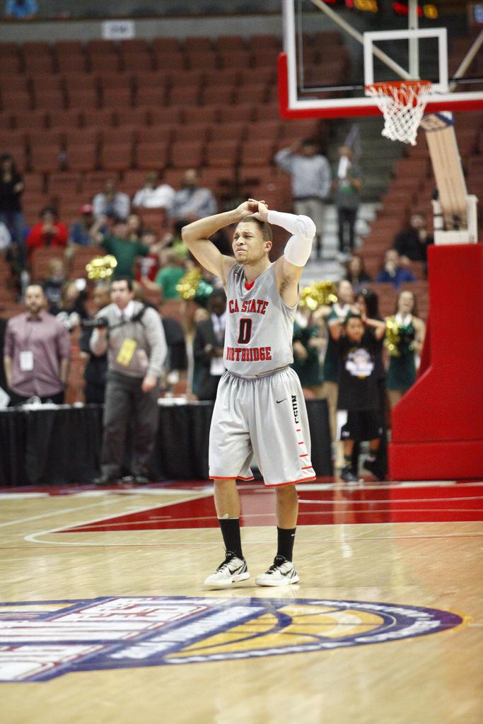 Josh Greene, center in frustration after a costly turnover resulting a 61-59 loss over Cal Poly on Saturday, March 15, 2014 at the Honda Center in Anaheim, Calif. (David J. Hawkins/PhotoEditor)