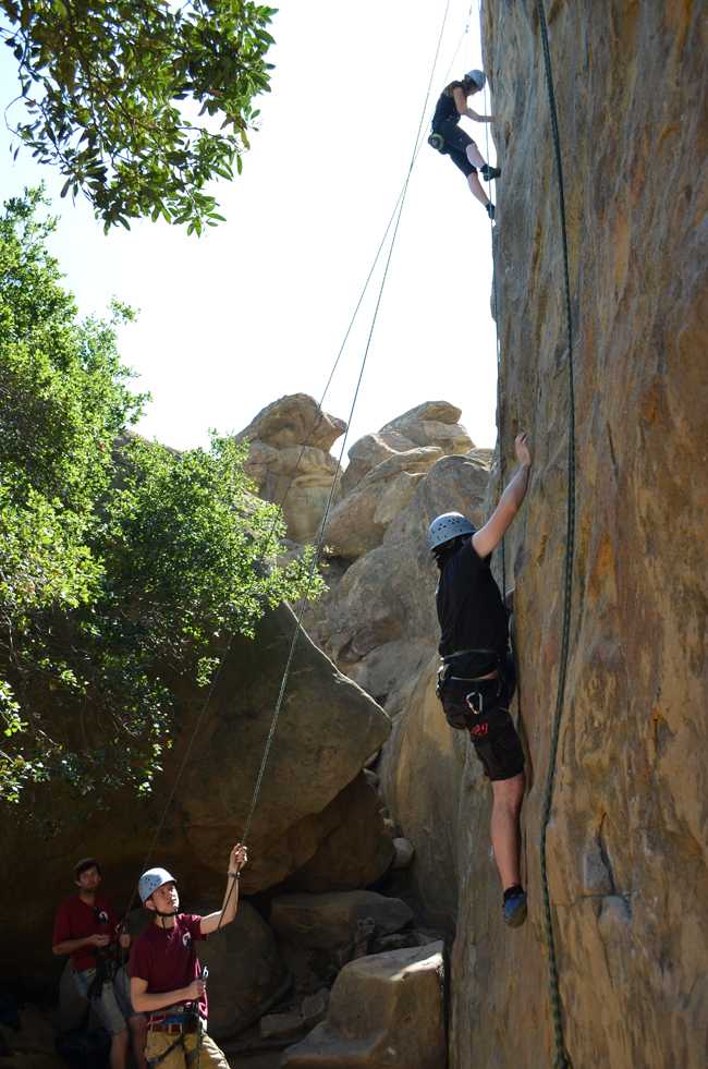 Nate Klapp, bottom right, and Lindsay Barney, top right, scaling the wall as they make their accent on Friday, March 14, 2014 at Stony Point park. (Photo Credit: Christian Akers/Contributor)