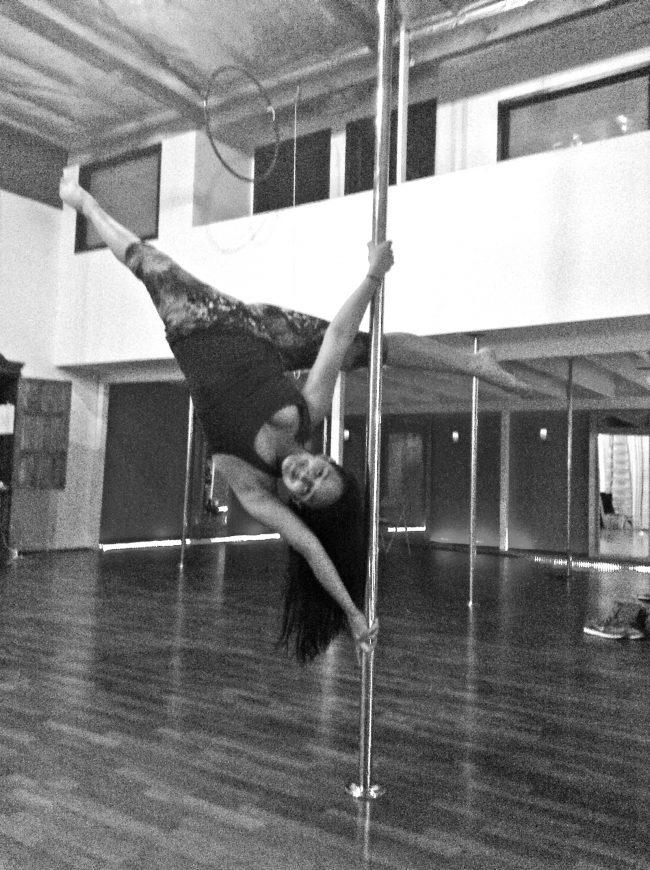 Nicolo Socola/Daily Sundial Sergia Louise Anderson, owner of The Vertitude, a pole dancing studio, shows off her talent with an aerial pose.