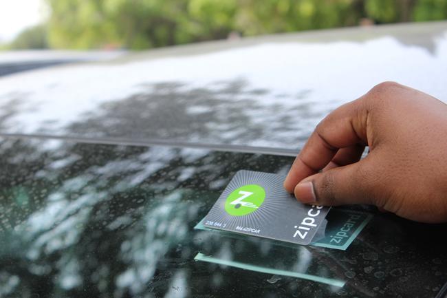 Samuel Boppuri, electrical engineer grad student, made a reservation to use the Zipcar Saturday morning. Placing the zipcar card on top of the zipcar sticker unlocks and locks the car. The Zipcars do offer their services on weekends.