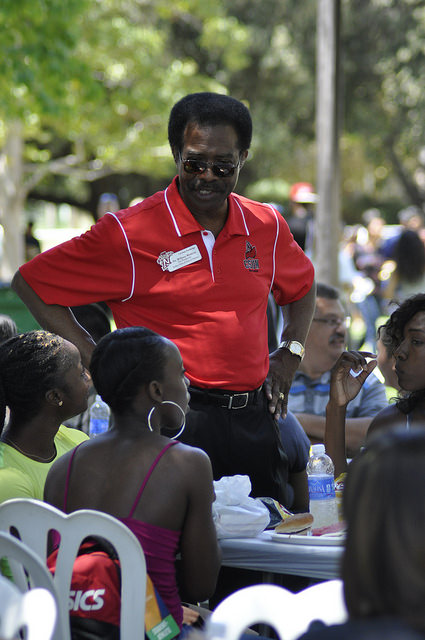 William Watkins, vice president of Student Affairs and Dean of Students chats with students attending the annual President's Lunch. -Crystal Lambert Sundial Staff