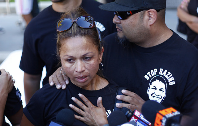 Jamie Chastened, Right holds Maria Casteneda, Armando Villa's aunt as she speaks to the press after President Dianne F. Harrison reads the report on the Pi Kappa Phi Fraternity incident at the University Hall on Friday. The fraternity Pi Kappa Phi chapter at CSUN has been forever removed from the university following the death of Armando Villa. (Photo credit: David J. Hawkins/Sundial Staff