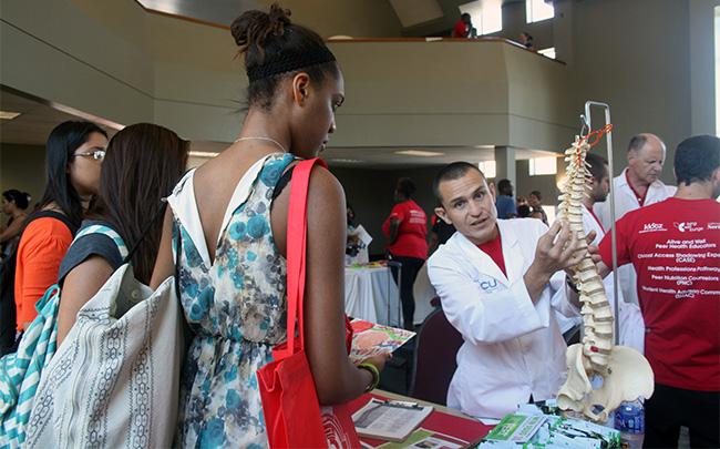 CSUN chiropractors handed out flyers to students on Sept. 17 in the Grand Salon to inform them about what medical enhancements our student health center provides. Photo Credit: Rasta Ghafouri/ The Sundial