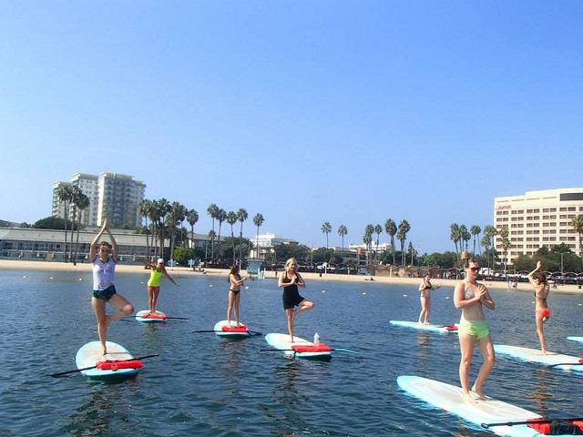 Every weekend, Yogaqua holds classes on paddle boards in Marina Del Rey. Photo courtesy of Yogaaqua. 