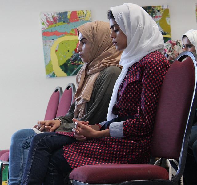 Ebtehal Alrecucaily, 27, and Fatimah Hakeem, 27, family friends of Ahmed Alkadi, attended Abdullah Alkadi's memorial gathering held at CSUN on Oct. 21. Hakeem played audio of the Quran as people walked into the memorial. 