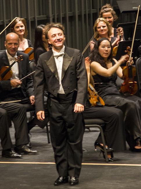 Pianist, Jean-Efflam Bavouzet takes a bow after the London Philharmonic Choir performance at the California State University, Northirdge Valley Performing Arts Center in Northridge, Calif. on Friday, Oct. 10. Photo Credit: Jessica Boyer/ Contributor
